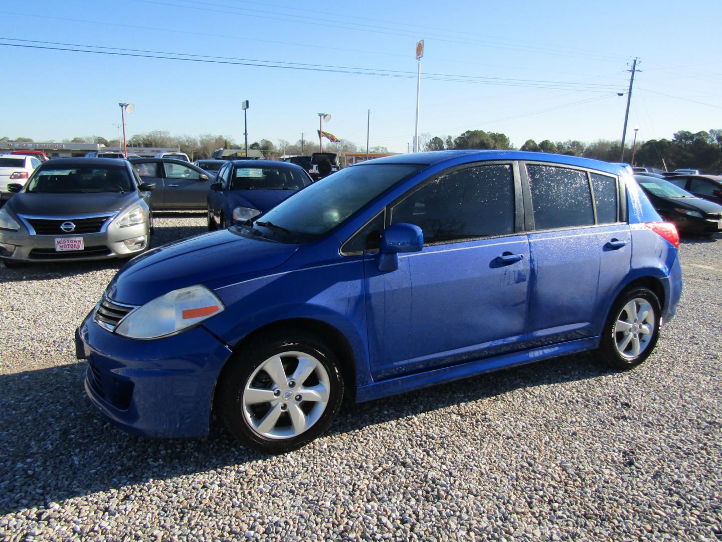 2012 Blue /Black Nissan Versa 1.8 SL Hatchback (3N1BC1CP4CK) with an 1.8L L4 DOHC 16V engine, Automatic transmission, located at 15016 S Hwy 231, Midland City, AL, 36350, (334) 983-3001, 31.306210, -85.495277 - Photo#2